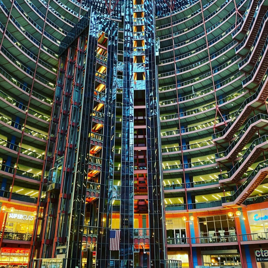 Interior view of a modern atrium showcasing stunning architectural design and office spaces.